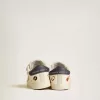 Baby School en piel napa con estampado musical y estrella de ante blanco