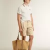Bermudas de hombre en denim beige con acabado desgastado.