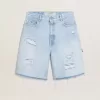 Bermudas de mujer en denim con efecto desgastado Bermudas de mujer en denim con efecto desgastado
