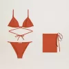 Bikini de mujer en jersey acanalado rojo ladrillo con cordones y detalles dorados