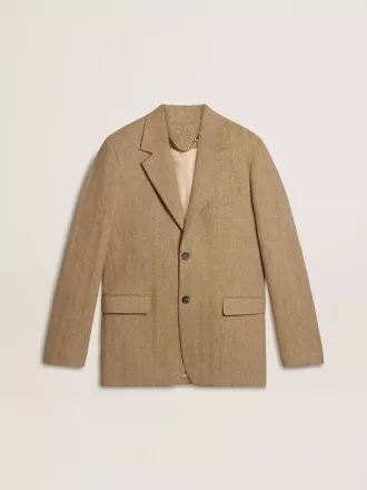 Blazer de hombre de una sola botonadura en mezcla de lino con diseño chevron en color arena.