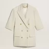 Blazer de mujer en mezcla de lana a rayas blancas y grises con mangas cortas. Blazer de mujer en mezcla de lana a rayas blancas y grises con mangas cortas.