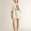 Blazer de mujer en mezcla de lana a rayas blancas y grises con mangas cortas. Blazer de mujer en mezcla de lana a rayas blancas y grises con mangas cortas.