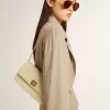 Bolso Gioia en piel de oveja gris mineral con detalles dorados Bolso Gioia en piel de oveja gris mineral con detalles dorados