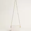 Bolso Mini Star en piel color blanco mantequilla con estrella tono sobre tono