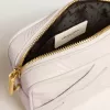 Bolso Mini Star en piel color blanco mantequilla con estrella tono sobre tono