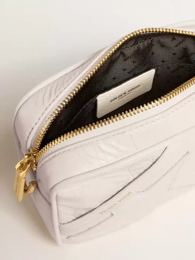 Bolso Mini Star en piel color blanco mantequilla con estrella tono sobre tono
