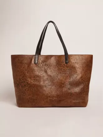 Bolso Pasadena en piel martillada con estampado de leopardo y asas negras a contraste