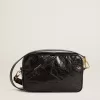 Bolso Star en piel negra brillante con estrella tono sobre tono Bolso Star en piel negra brillante con estrella tono sobre tono