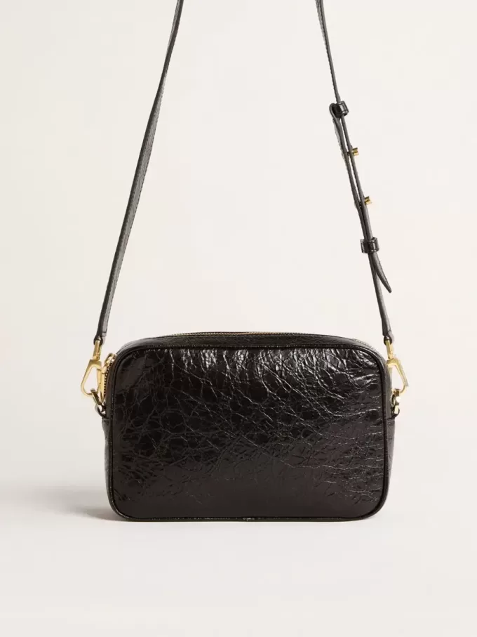 Bolso Star en piel negra brillante con estrella tono sobre tono Bolso Star en piel negra brillante con estrella tono sobre tono