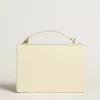 Bolso Venezia en piel acolchada color mantequilla con doble charm