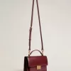 Bolso Venezia en piel bordada burdeos con detalles dorados