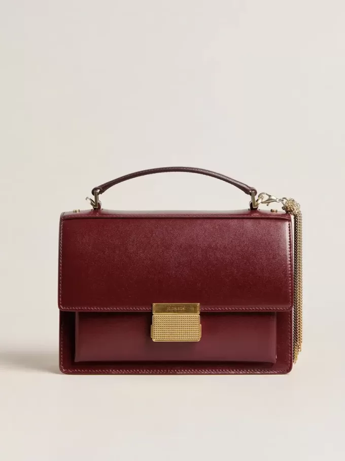Bolso Venezia en piel bordada burdeos con detalles dorados