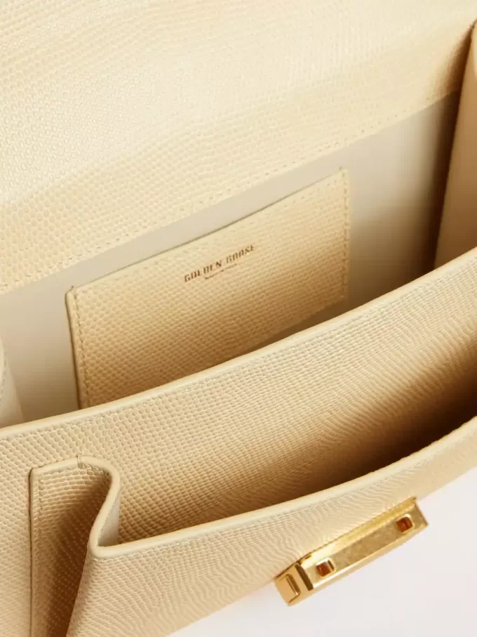 Bolso Venezia en piel con estampado pitón beige y detalles dorados. Bolso Venezia en piel con estampado pitón beige y detalles dorados.
