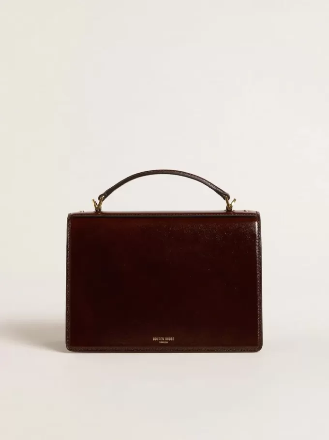 Bolso Venezia en piel laminada marrón oscuro con detalles dorados Bolso Venezia en piel laminada marrón oscuro con detalles dorados