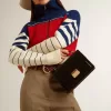 Bolso Venezia en piel negra con detalles dorados Bolso Venezia en piel negra con detalles dorados