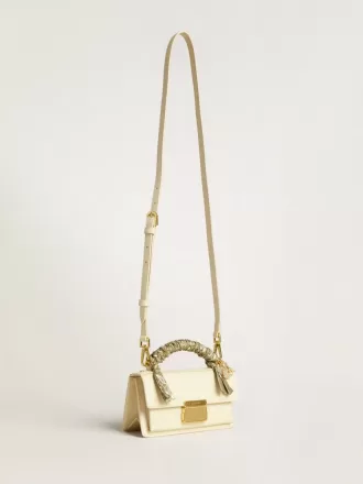 Bolso Venezia pequeño en piel color mantequilla con bufanda trenzada y doble charm.