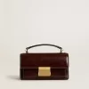 Bolso Venezia pequeño en piel laminada marrón oscuro con detalles dorados Bolso Venezia pequeño en piel laminada marrón oscuro con detalles dorados
