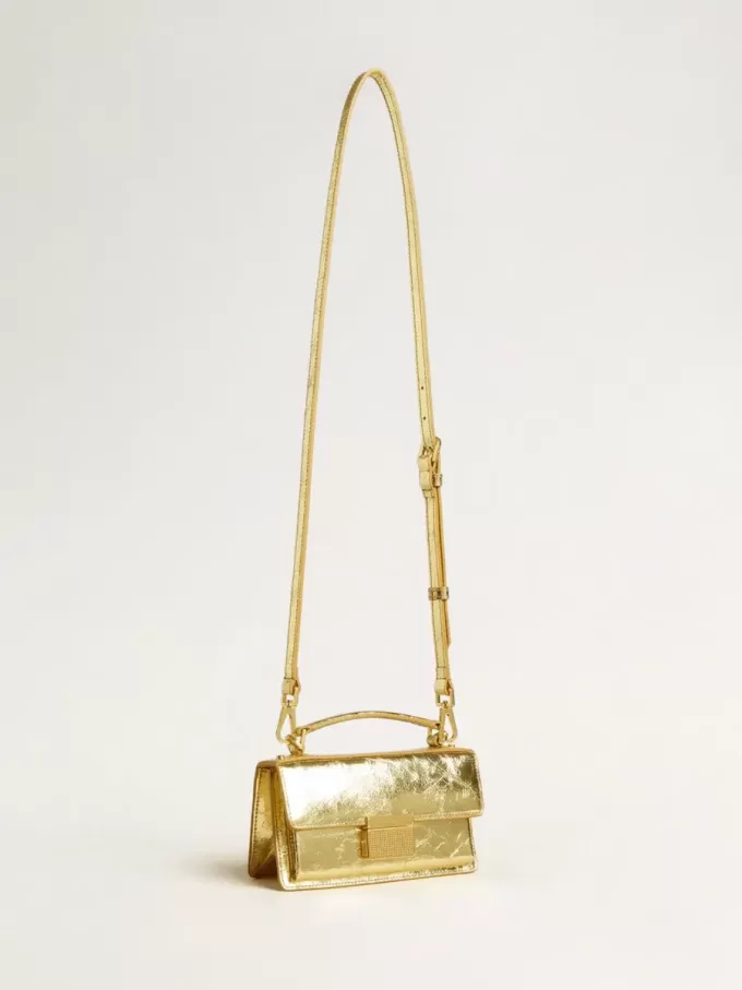 Bolso Venezia pequeño en piel metalizada dorada con detalles dorados. Bolso Venezia pequeño en piel metalizada dorada con detalles dorados.