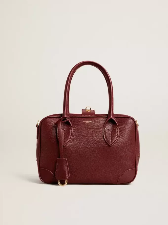 Bolso Vita en piel burdeos con detalles dorados Bolso Vita en piel burdeos con detalles dorados