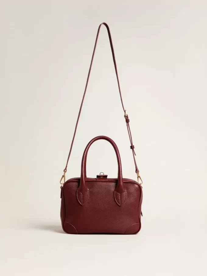 Bolso Vita en piel burdeos con detalles dorados Bolso Vita en piel burdeos con detalles dorados