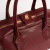 Bolso Vita en piel burdeos con detalles dorados Bolso Vita en piel burdeos con detalles dorados