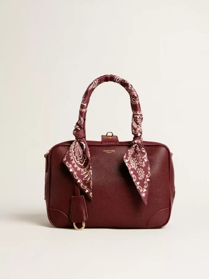 Bolso Vita en piel burdeos con detalles dorados Bolso Vita en piel burdeos con detalles dorados