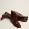 Botas Charlie para mujer en piel marrón oscuro y abrazadera en el talón Botas Charlie para mujer en piel marrón oscuro y abrazadera en el talón