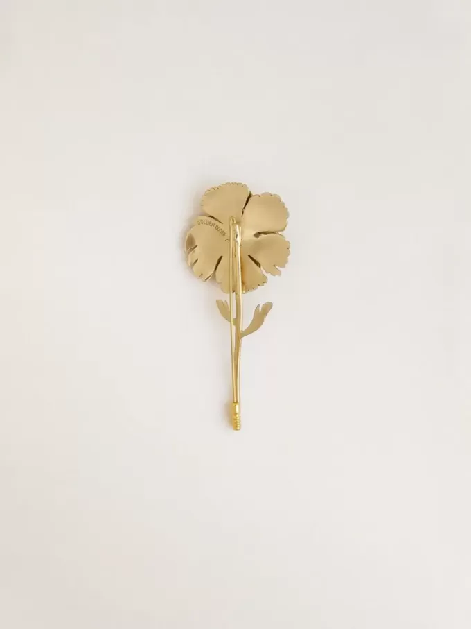 Broche dorado con diseño floral Broche dorado con diseño floral