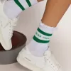 Calcetines de algodón con acabados desgastados, rayas verdes y logotipo Calcetines de algodón con acabados desgastados, rayas verdes y logotipo
