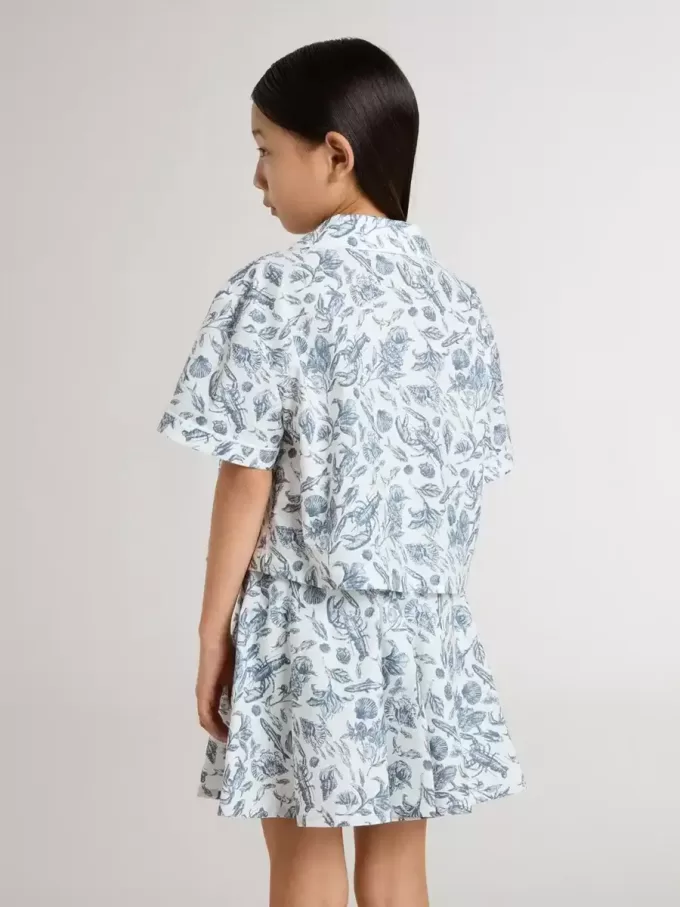 Camisa corta blanca para niña con estampado azul