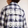 Camisa de cuadros azules y blancos para niño con estampado en la espalda Camisa de cuadros azules y blancos para niño con estampado en la espalda