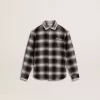 Camisa infantil a cuadros blancos y negros con bordados blancos Camisa infantil a cuadros blancos y negros con bordados blancos