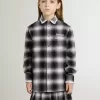 Camisa infantil a cuadros blancos y negros con bordados blancos Camisa infantil a cuadros blancos y negros con bordados blancos