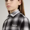 Camisa infantil a cuadros blancos y negros con bordados blancos Camisa infantil a cuadros blancos y negros con bordados blancos