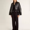 Camisa negra de mujer con rayas verticales y cierre con nudo lateral Camisa negra de mujer con rayas verticales y cierre con nudo lateral