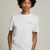 Camiseta blanca de mujer con logotipo y estrella plateados brillantes Camiseta blanca de mujer con logotipo y estrella plateados brillantes