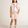 Camiseta blanca para niña con letras doradas y purpurina rosa. Camiseta blanca para niña con letras doradas y purpurina rosa.