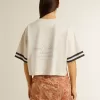 Camiseta corta oversize para mujer en jersey blanco con bordados y estampado «Venezia Mediterraneo». Camiseta corta oversize para mujer en jersey blanco con bordados y estampado «Venezia Mediterraneo».