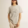 Camiseta de mujer en algodón gris jaspeado con estampado de temporada Camiseta de mujer en algodón gris jaspeado con estampado de temporada