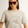 Camiseta de mujer en algodón gris jaspeado con estampado de temporada Camiseta de mujer en algodón gris jaspeado con estampado de temporada