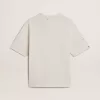 Camiseta unisex blanca con estampado mediterráneo y parche dorado Pescheria en la manga Camiseta unisex blanca con estampado mediterráneo y parche dorado Pescheria en la manga