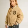 Cazadora bomber beige de felpa para niños Cazadora bomber beige de felpa para niños