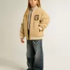 Cazadora bomber beige de felpa para niños Cazadora bomber beige de felpa para niños