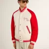Cazadora bomber en blanco desgastado y rojo con bordados Cazadora bomber en blanco desgastado y rojo con bordados