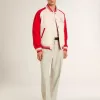 Cazadora bomber en blanco desgastado y rojo con bordados Cazadora bomber en blanco desgastado y rojo con bordados