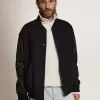 Cazadora bomber para hombre en lana azul oscuro con mangas de cuero Cazadora bomber para hombre en lana azul oscuro con mangas de cuero