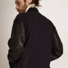 Cazadora bomber para hombre en lana azul oscuro con mangas de cuero Cazadora bomber para hombre en lana azul oscuro con mangas de cuero