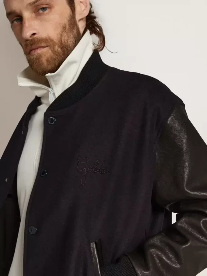 Cazadora bomber para hombre en lana azul oscuro con mangas de cuero Cazadora bomber para hombre en lana azul oscuro con mangas de cuero