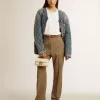 Chaqueta acolchada azul para mujer en denim de algodón con acabado desgastado Chaqueta acolchada azul para mujer en denim de algodón con acabado desgastado